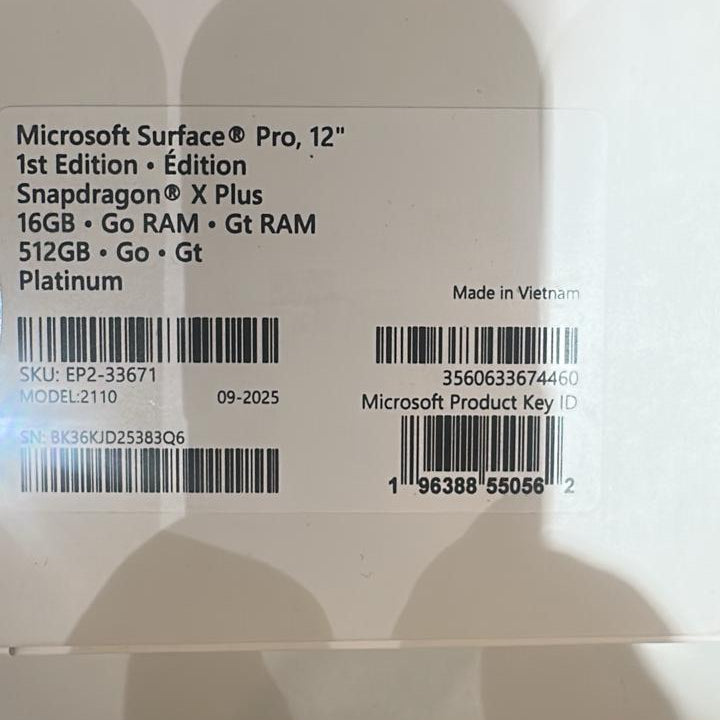 Back view of a Microsoft Surface Pro 12" with product details and barcodes.